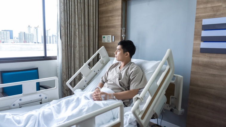 man in a hospital bed